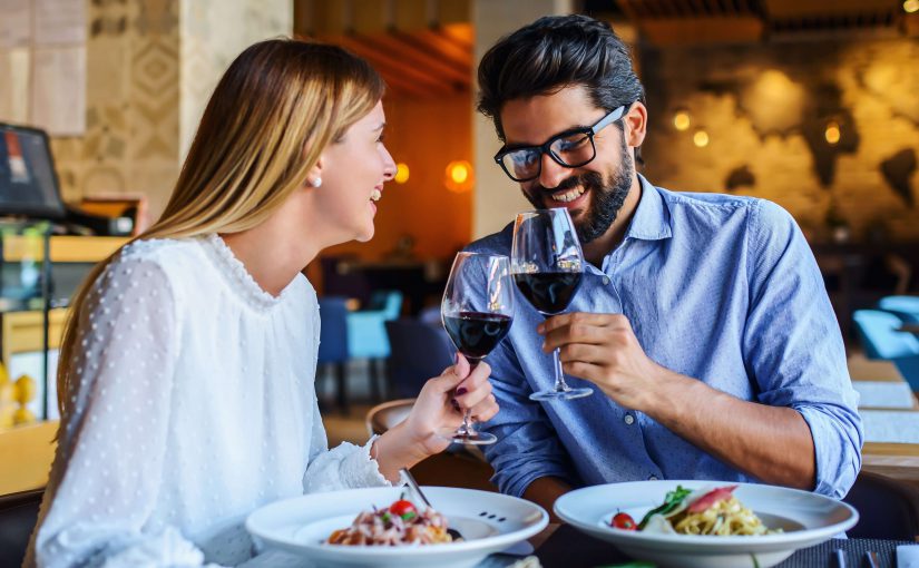 A woman and a man enjoying Murrells Inlet Italian Restaurants.